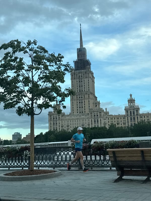 Afternoon jogging scene captured near Moscow's Kotelnicheskaya Embankment Building