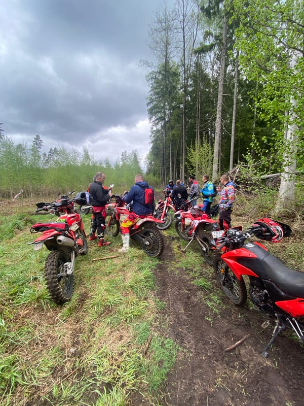 Dirt bike group stops near forest in Belarus