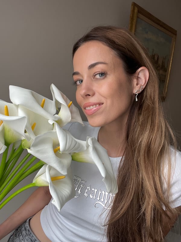 Woman with flowers photographed in Belgrade residential district