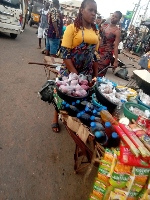 Street vendors conduct daily business in Nkpor marketplace