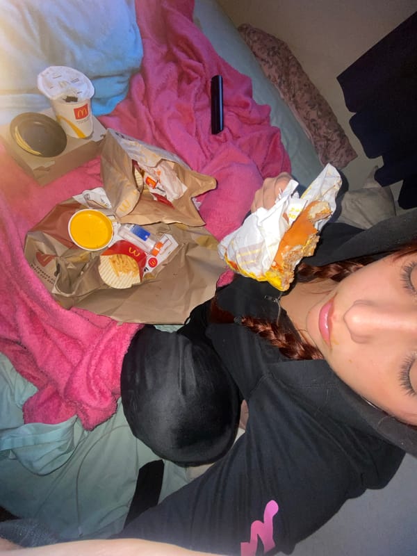 Person enjoys McDonald's meal on bed in Buenos Aires