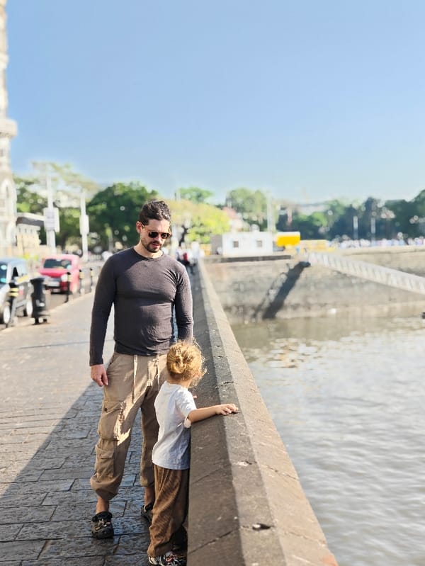 Father and child tour Mumbai landmarks during early morning hours