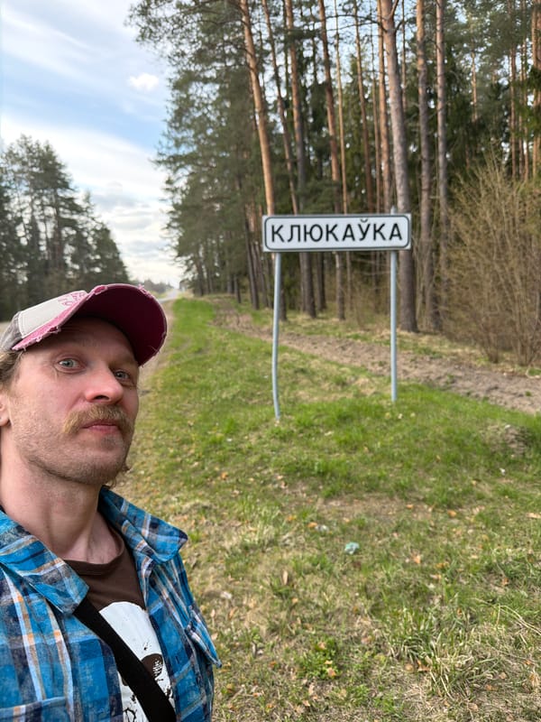 Rural Belarus scenes captured: man, cars, forest road