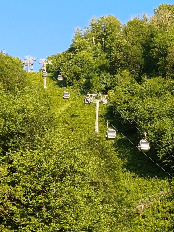 Visitors capture typical resort scenes at Rosa Khutor, Russia