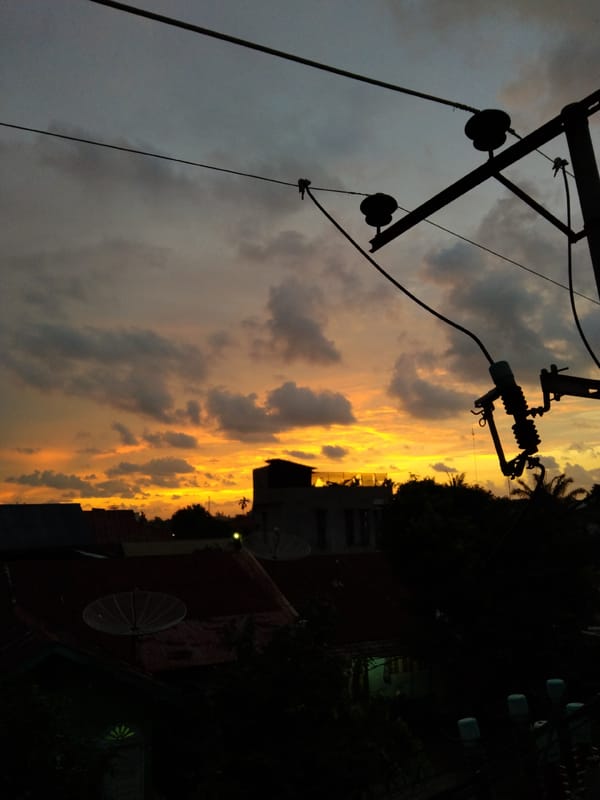 Dramatic sunset lights up Bireuenmeunasahdayah, Indonesia residential area