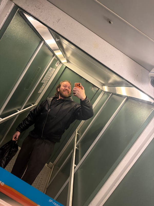 Bearded man photographs himself in Saint Petersburg morning scenes