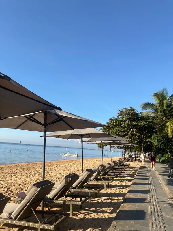 Sanur Beach on a busy, sun-filled afternoon in Denpasar