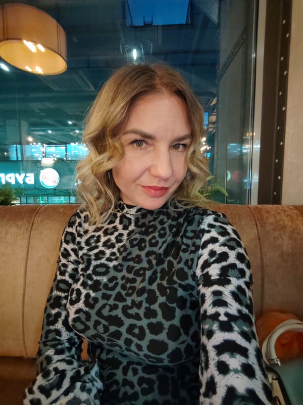 Woman enjoys evening meal at Saint Petersburg restaurant