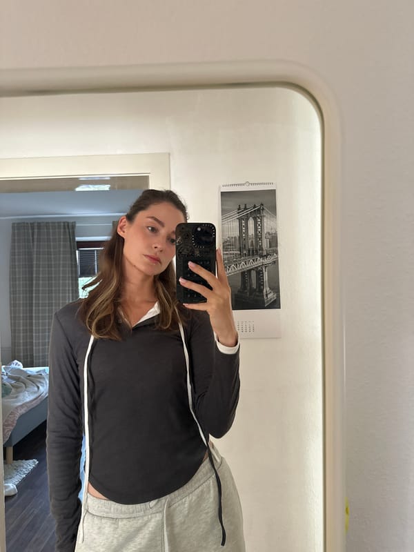 Woman takes selfies indoors in Kiel, Germany