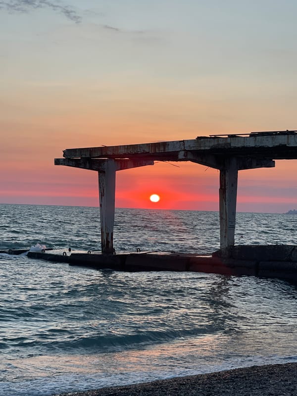 Red sunset over Sochi's Black Sea beach, early evening
