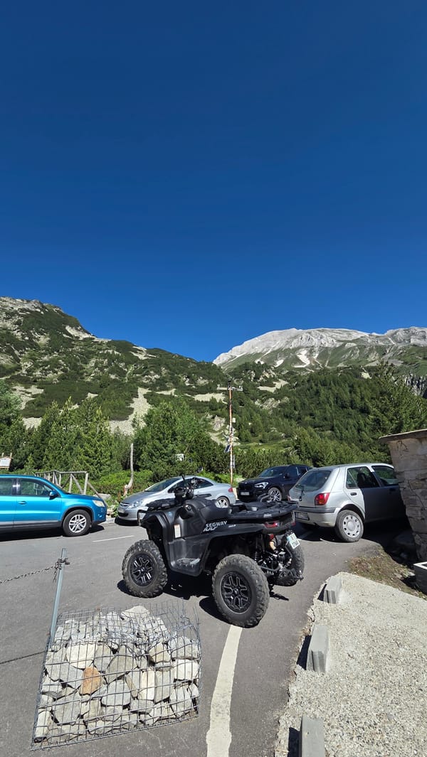 BMW and off-road Segway parked at a mountain stop in Bulgaria