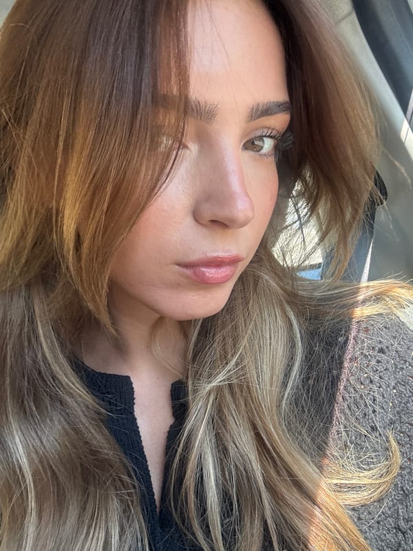 Woman takes portrait photos inside vehicle in Porto