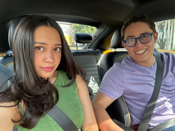 Two passengers documented during car journey in Puebla