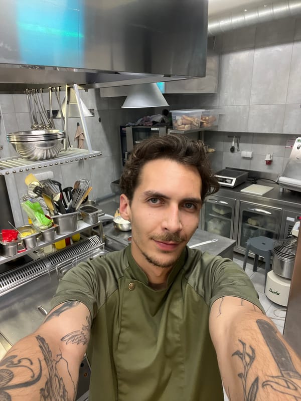 Chef takes selfie in commercial kitchen in Budva