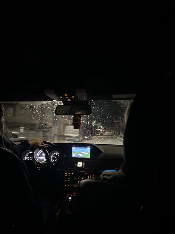 Driver navigates rainy night roads in Marchevo, Bulgaria