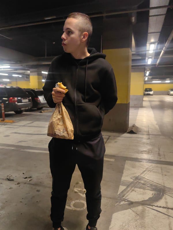Man eats snack in Sofia parking garage