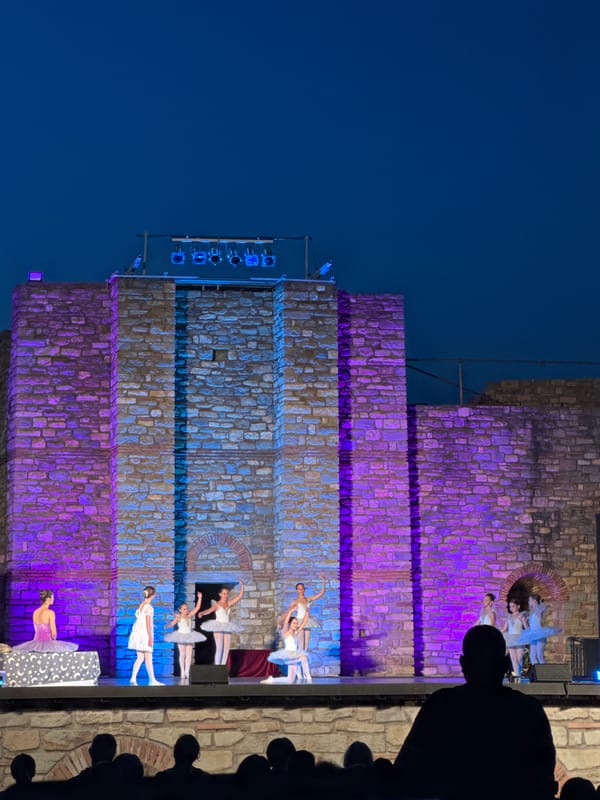Ballet performed against illuminated stone walls at Tsarevets Fortress