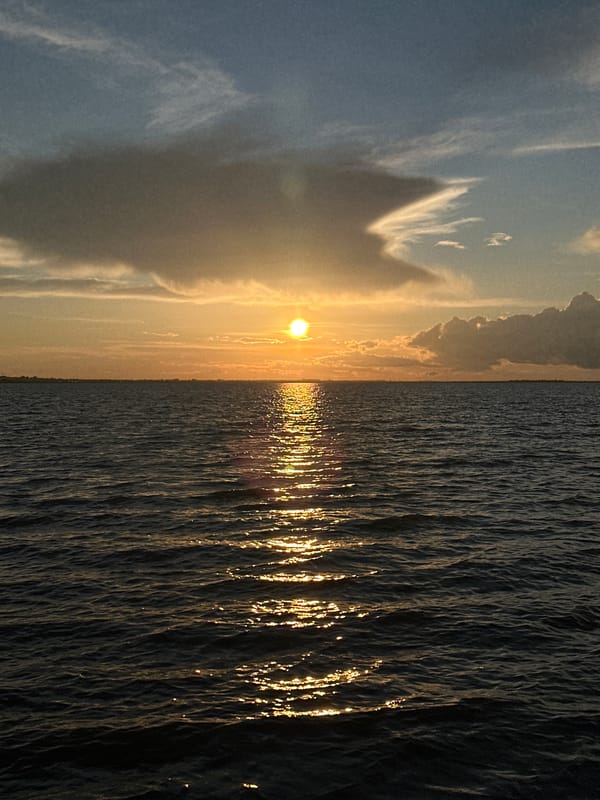 Golden sunset over dark water near Kokshetau, Kazakhstan