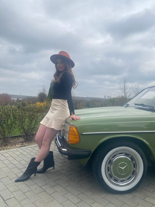 Woman poses with vintage Mercedes-Benz in Yekaterinburg photoshoot