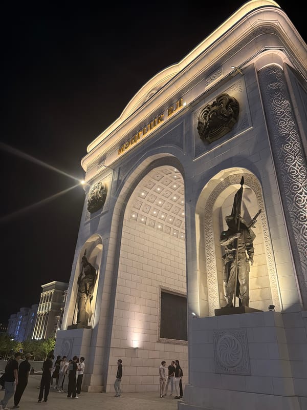 Astana's Mangilik El arch lit up at night