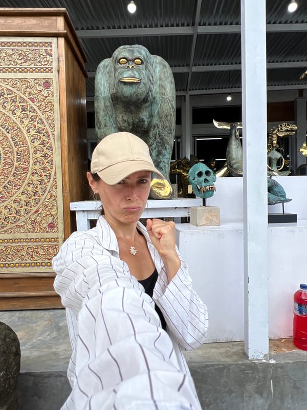 Tourists explore art galleries and sculpture workshops in Tegallalang