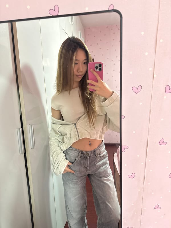 Woman takes mirror selfies with pink phone in China