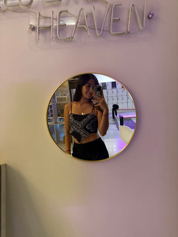 Woman takes mirror selfie in Puebla late night