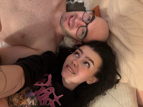 Couple photographed resting together in Kazan bedroom