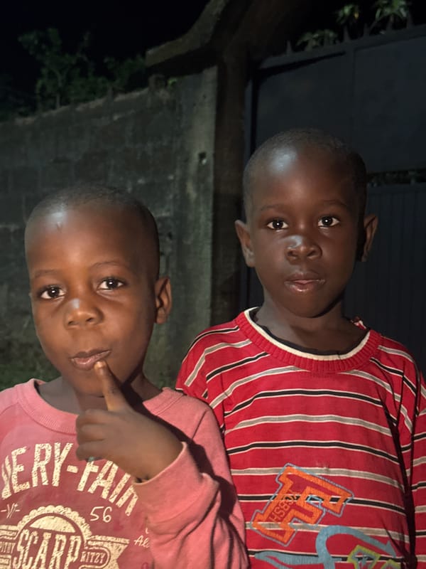Two boys photographed in close-up in Eziudo, Nigeria