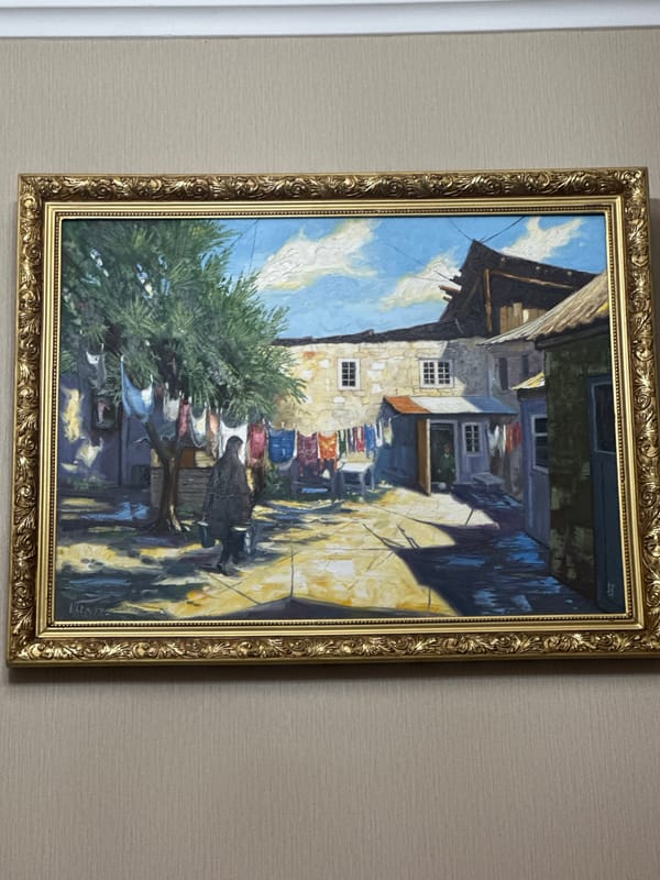Framed alleyway painting observed on wall by witness