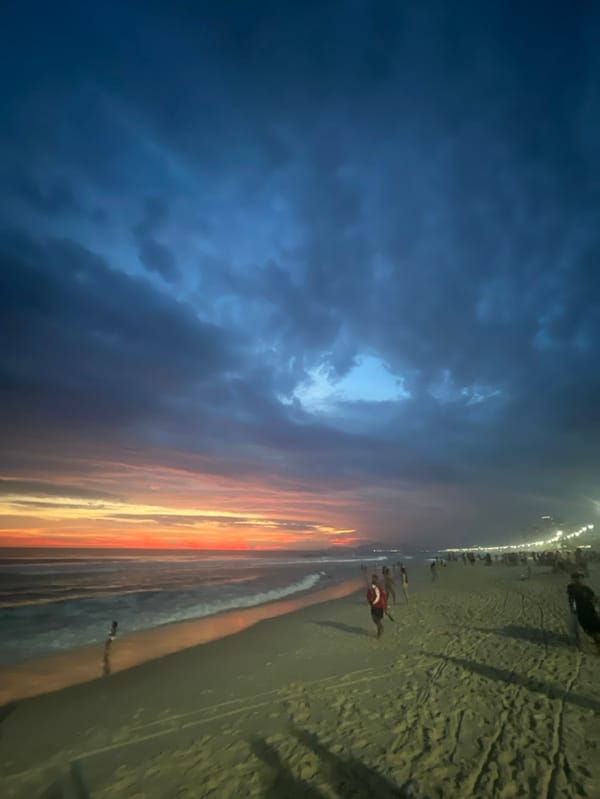 Dramatic sunset meets storm clouds over Rio beach