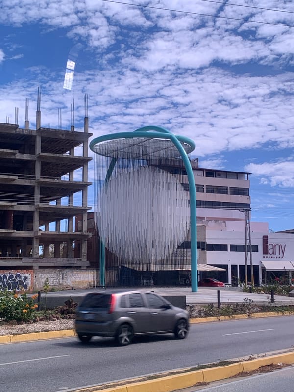 Construction continues near sculpture in Pampatar, Venezuela