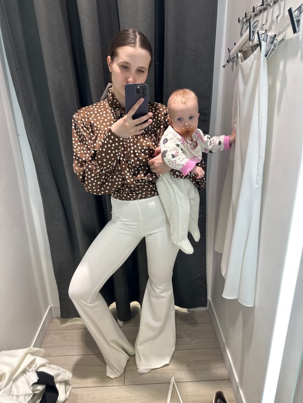 Woman with infant takes fitting room selfies in Moscow store
