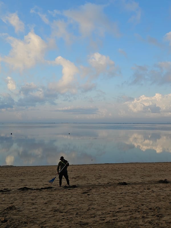 Sunset hour on Bali's beaches: ogoh-ogoh, staff sparring, and golden skies