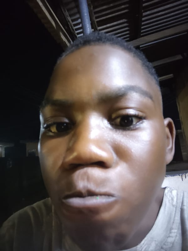Person takes multiple selfies indoors in Ikorodu, Nigeria