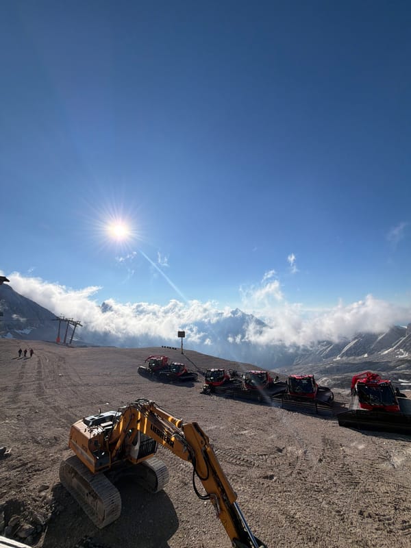Summer morning in the Bavarian Alps: machinery, clouds, and coffee