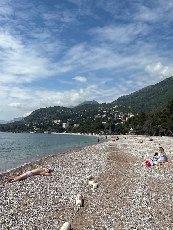 Man visits pebble beach in Bar, Montenegro