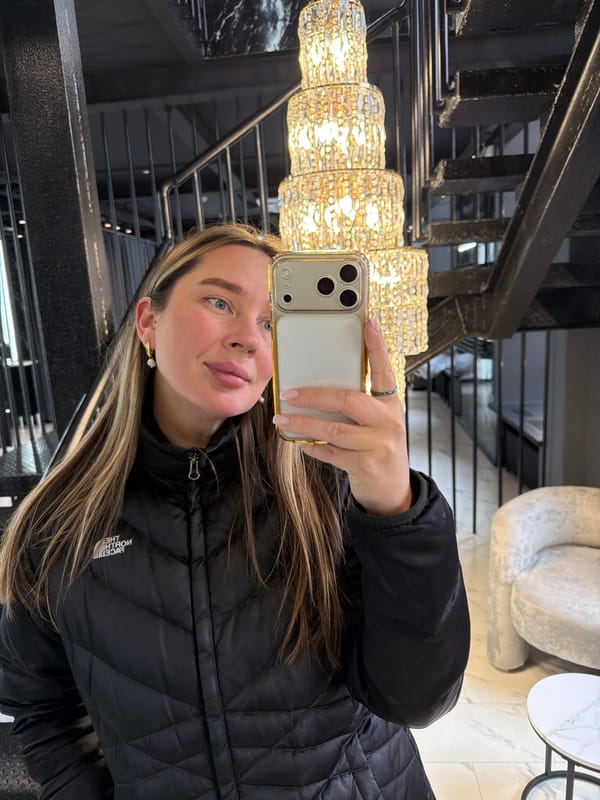 Woman takes selfie on stairs in Moscow building