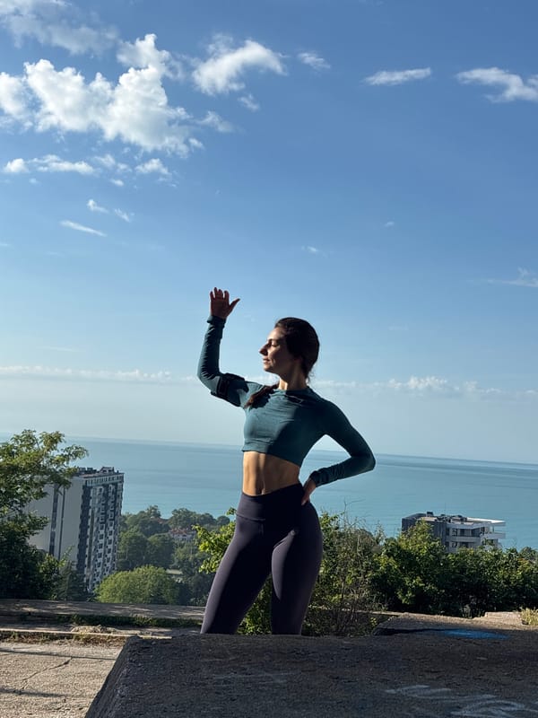 Woman performs yoga pose outdoors in Varna, Bulgaria