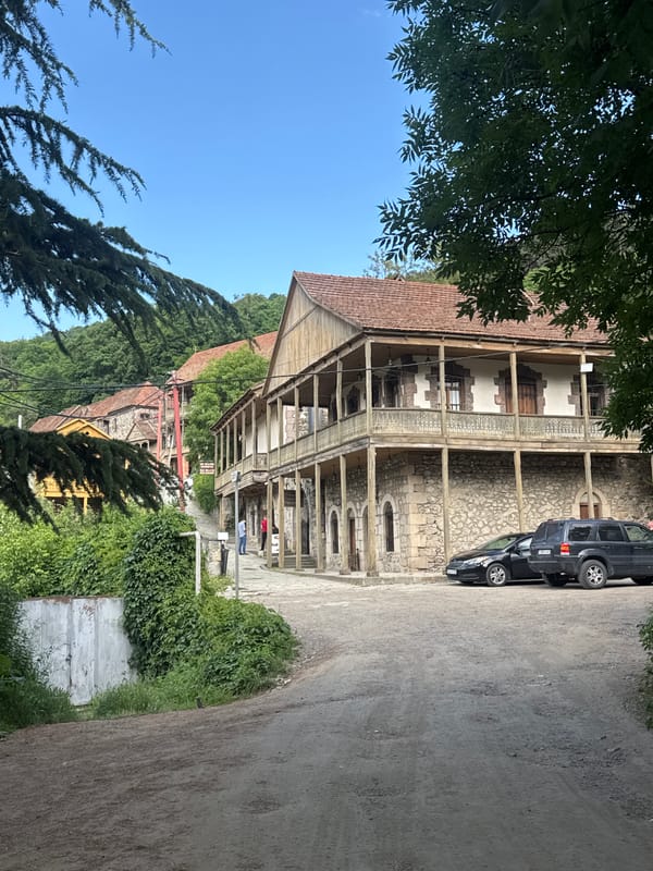 Traditional stone and wood architecture on a Dilijan street