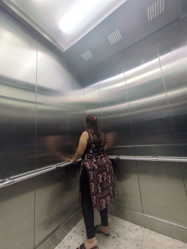 Elevator ride with snack captured in Bengaluru midday