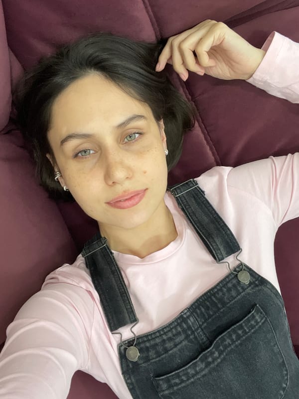 Woman rests on sofa in Izhevsk morning scene