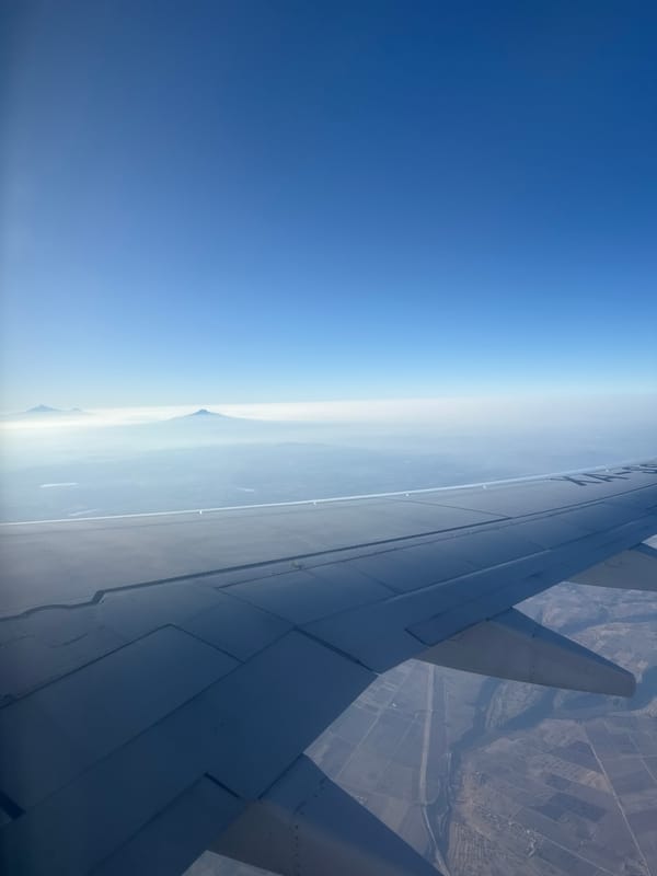 Passenger photographs mountain view from airplane over Miami Beach