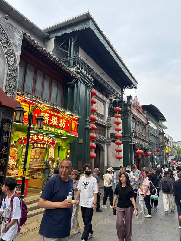Beijing districts show traditional lantern decorations, pedestrian activity