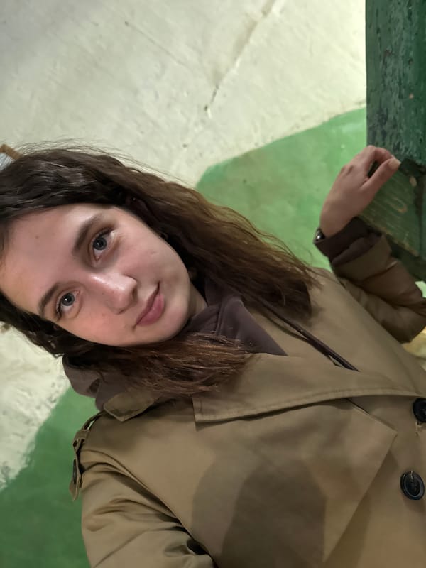 Woman photographed in dilapidated building interior, Vereshchagino Russia