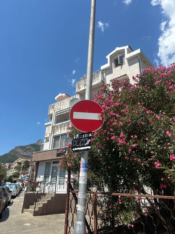 Street-level snapshot of Budva with mountain views beyond