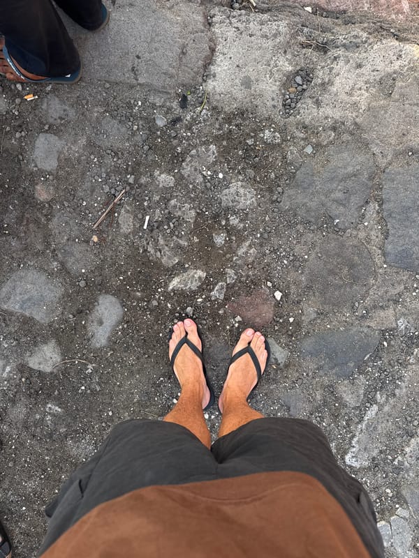 Sunset beach crowds and vendors captured in North Kuta