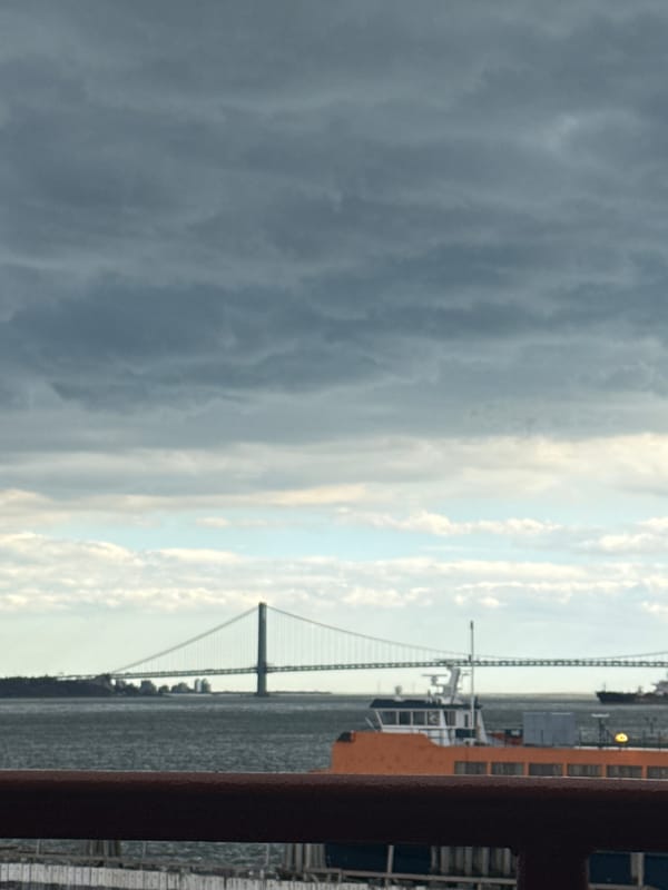 Ferry passenger photographs Verrazzano-Narrows Bridge from New York Harbor