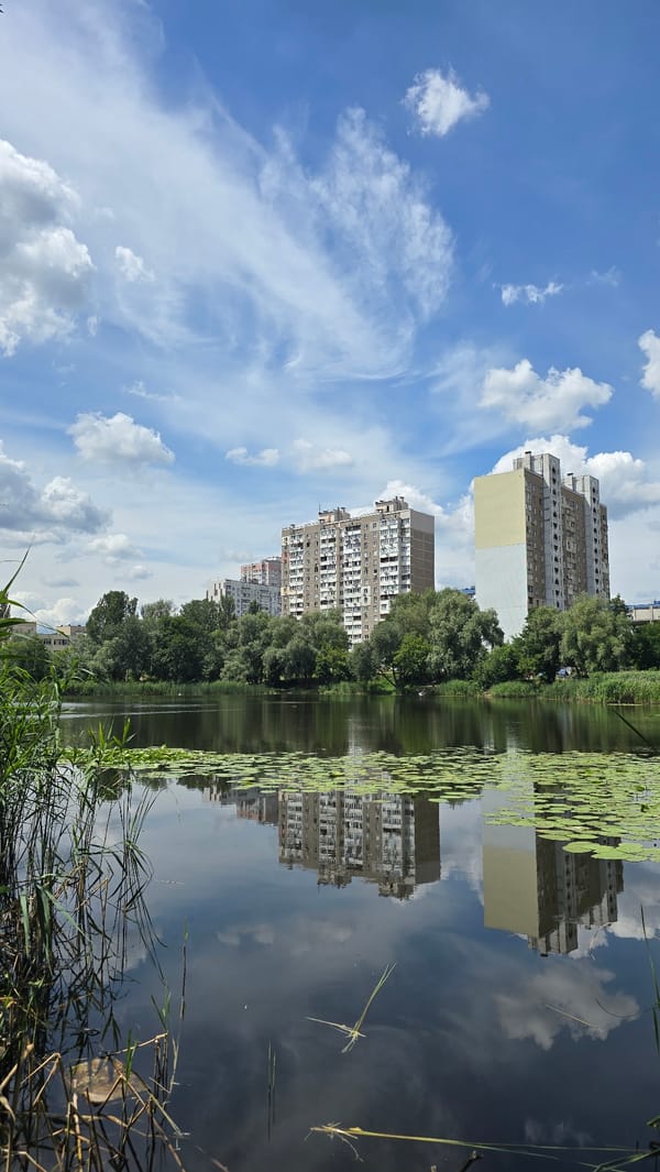 Boating through a lily-covered Kyiv lake on a summer morning