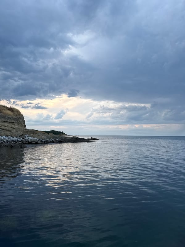 Rocky Black Sea coast at Tsarevo, chapel and beacon in view